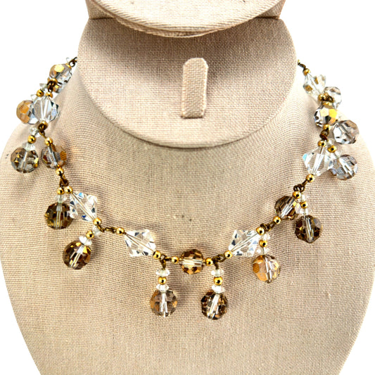 YSL signed fringe necklace with alternating clear and golden-bronze faceted crystal dangles on gold-tone chain, front view