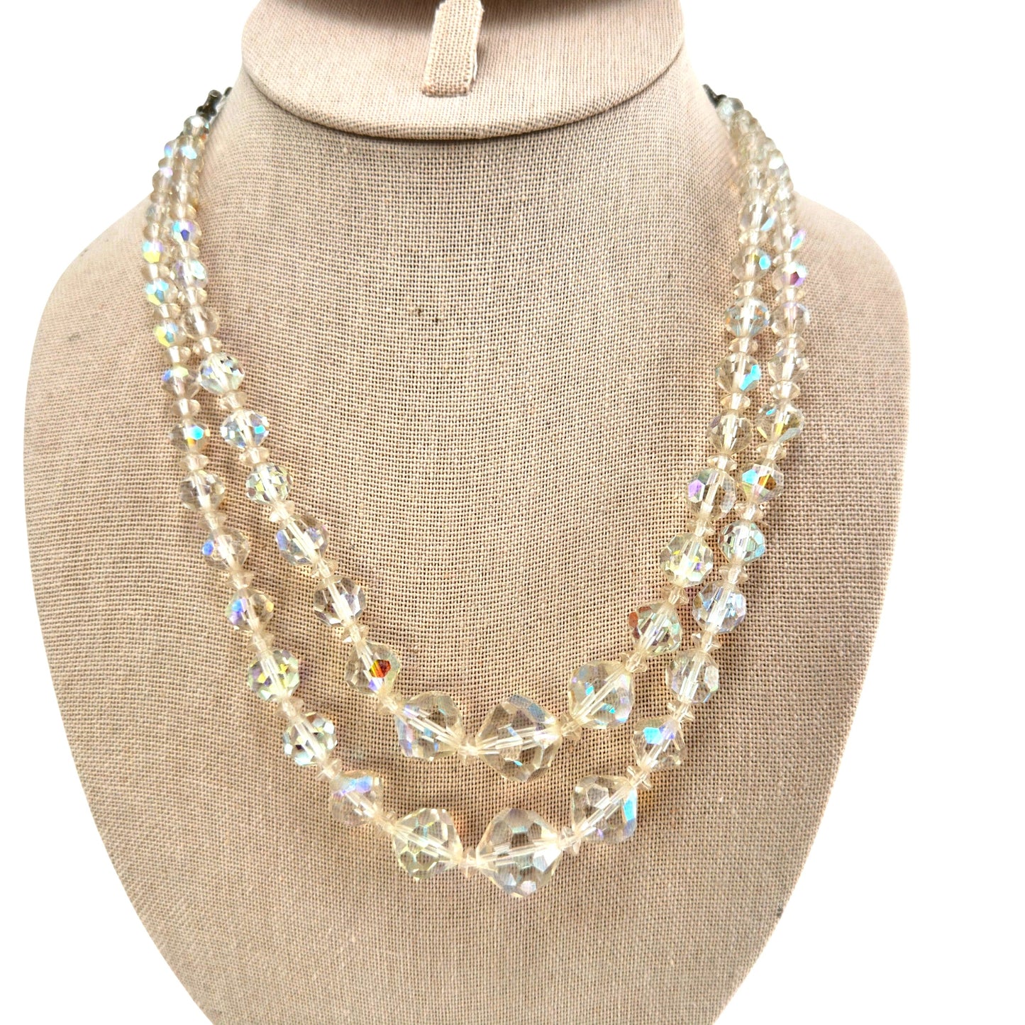 Double-strand clear faceted crystal bead necklace with aurora borealis iridescent coating, silver-tone box clasp, front view