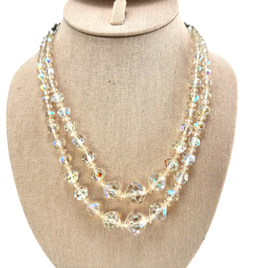 Double-strand clear faceted crystal bead necklace with aurora borealis iridescent coating, silver-tone box clasp, front view