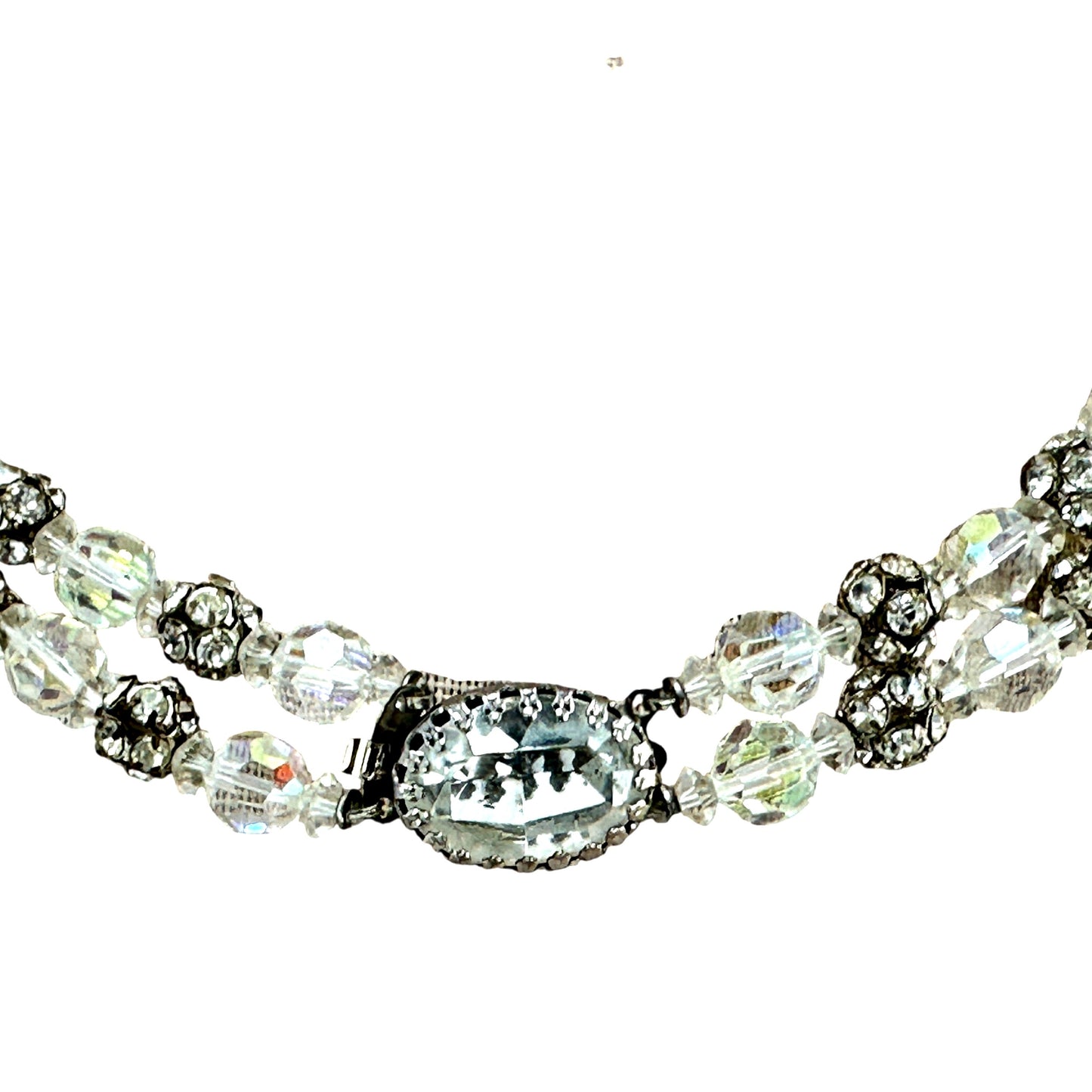 Full view of double-strand necklace laid flat showing graduated layered drape and iridescent aurora borealis crystal color...