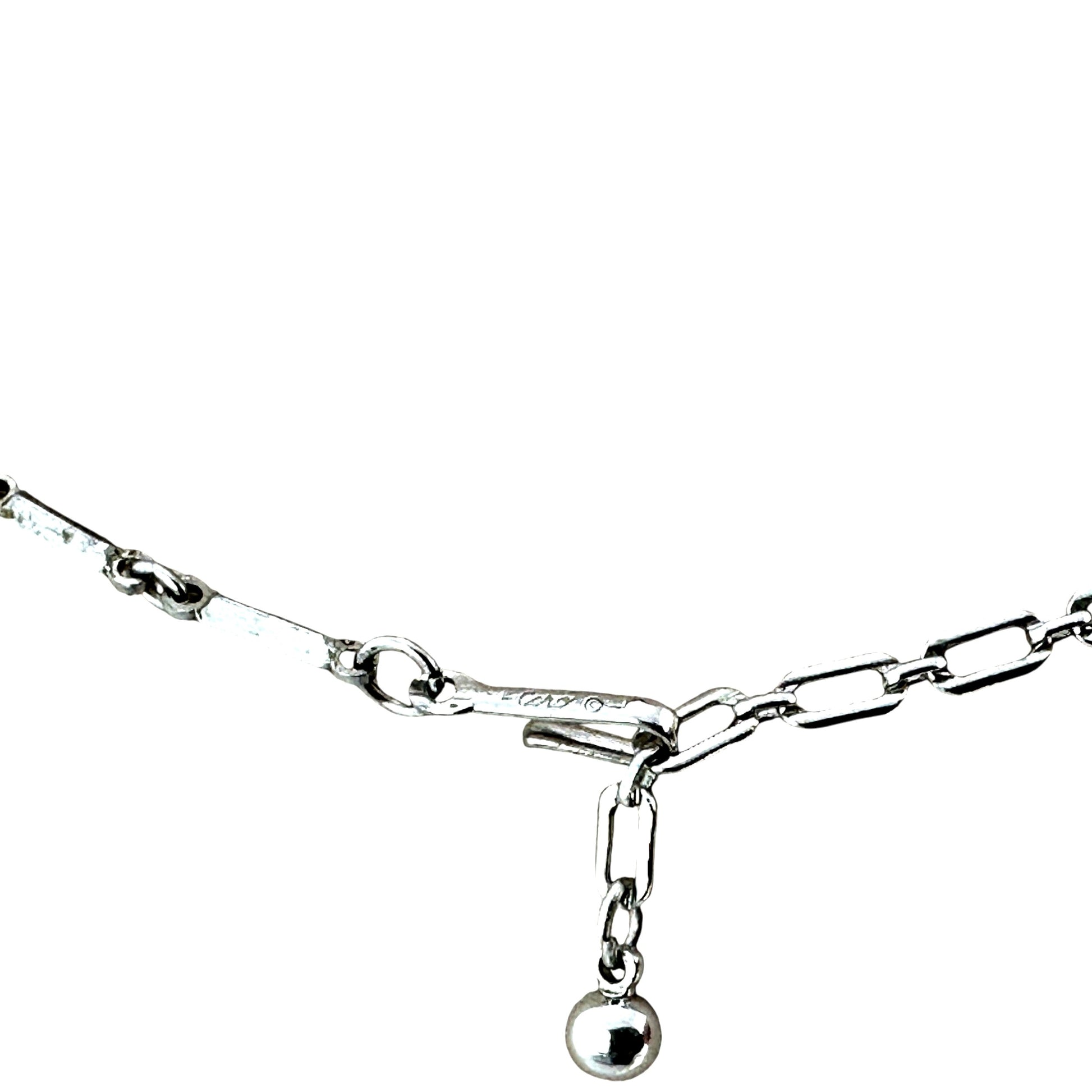 Coro copyright signature stamped on flat bar-link chain of silver-tone rhinestone bib necklace, mid-century construction