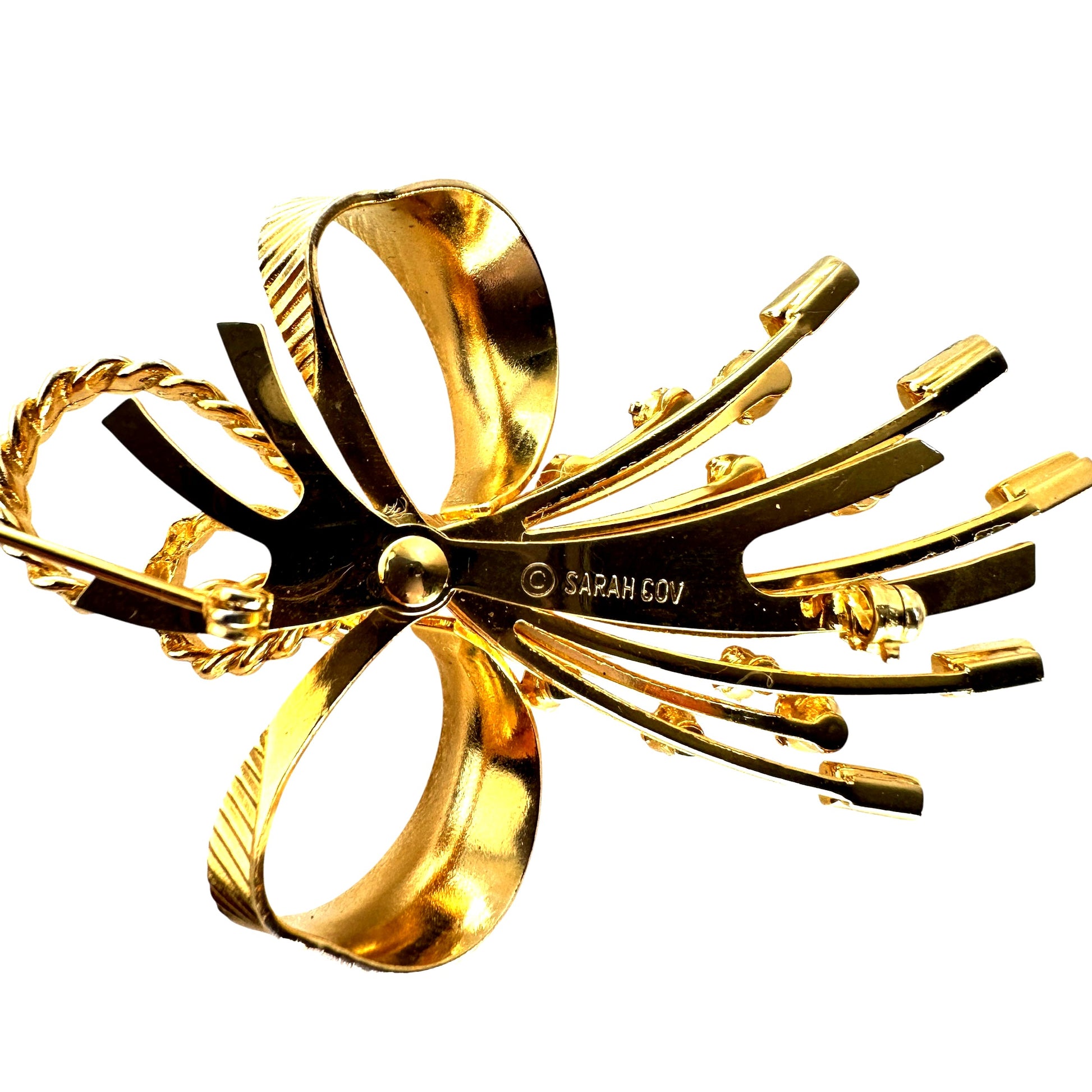 Back view of Sarah Coventry bow brooch showing pin clasp and maker mark